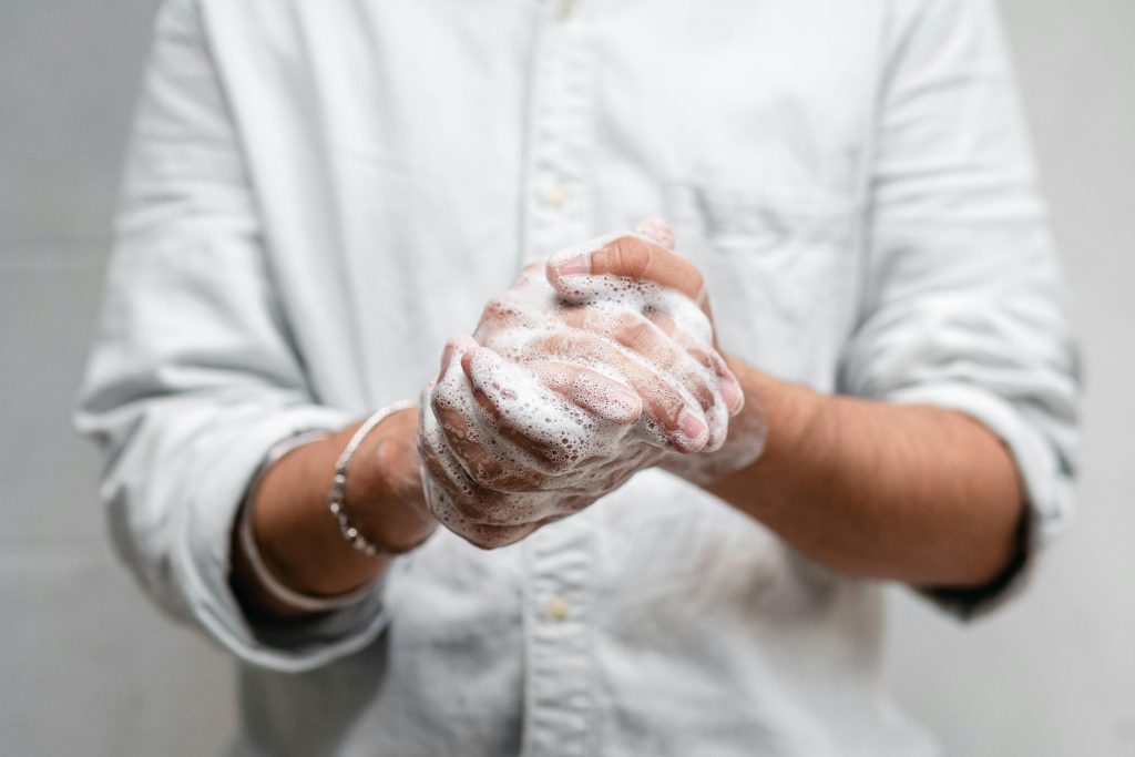 pexels-photo-4308205-4308205 Close-up of hands lathered with soap for thorough cleaning and hygiene.